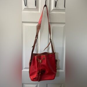 red drawstring bucket bag